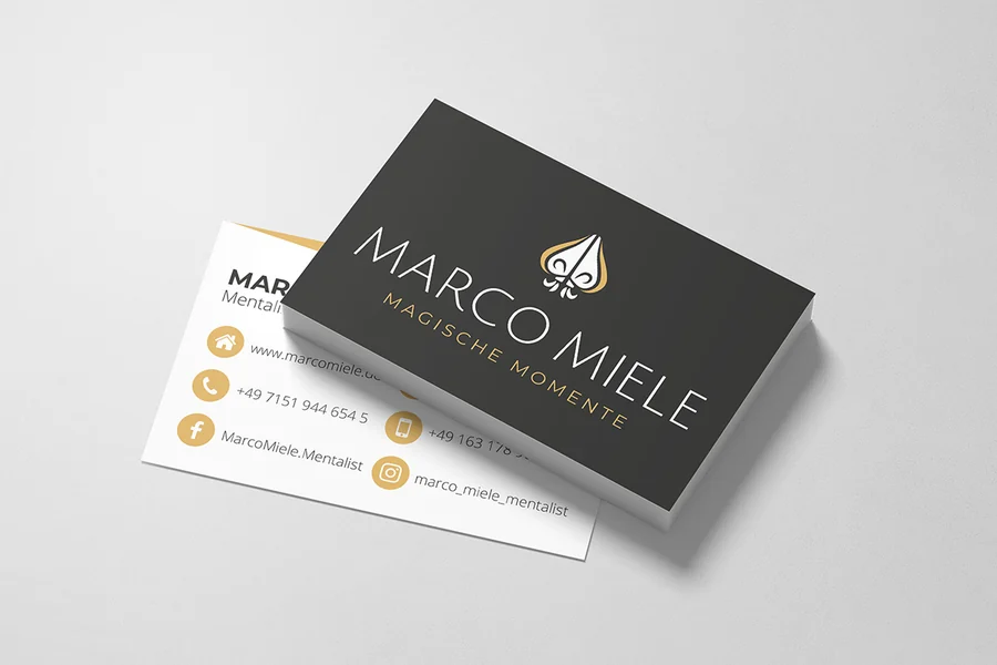 Visitenkarten von Marco Miele: Vorderseite in Anthrazit mit weißem und goldenem Logo, Rückseite weiß mit goldenen Symbolen